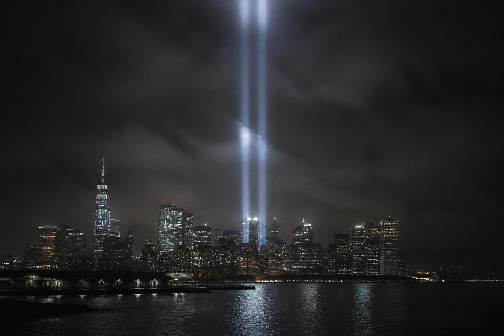 Twin beams of light rising over the Manhattan skyline at night, symbolizing September 11 remembrance